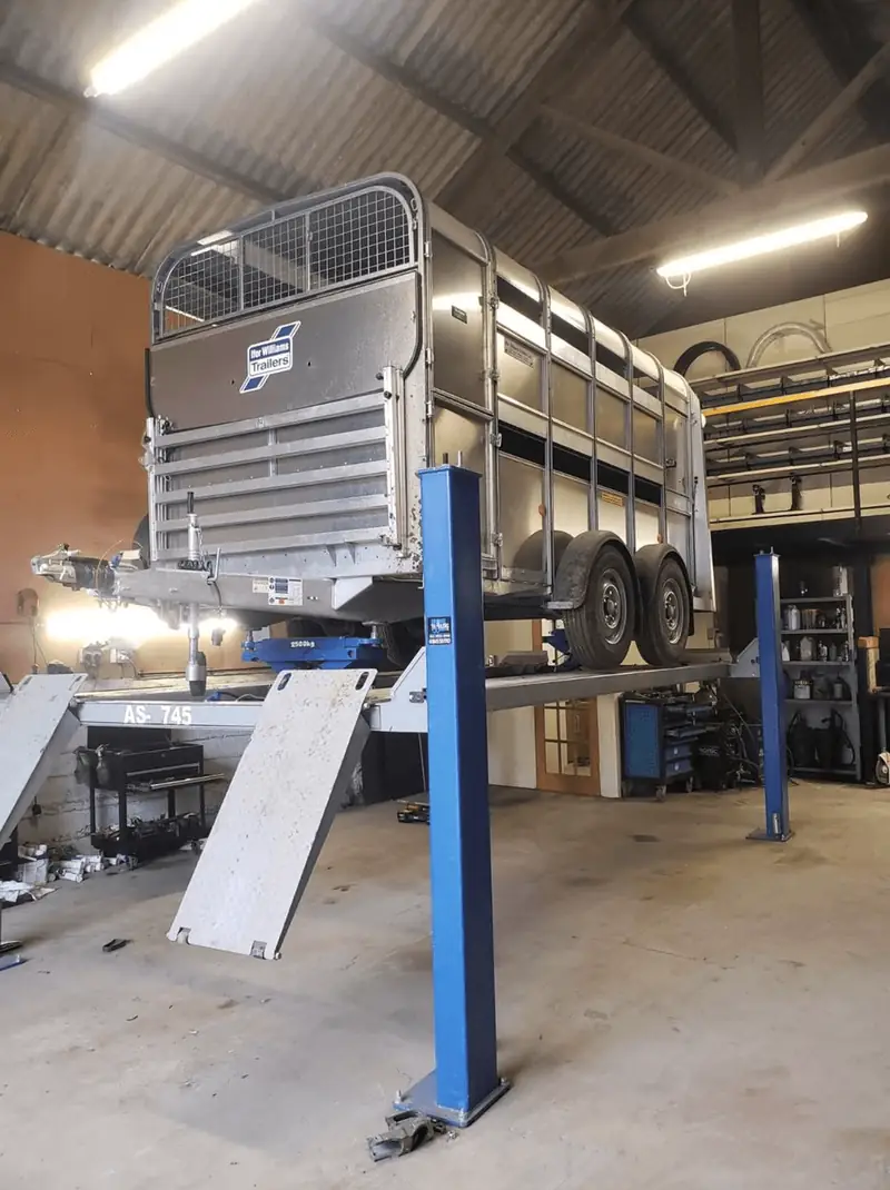 Trailer on the lift in the Richmond Trailer Centre service workshop